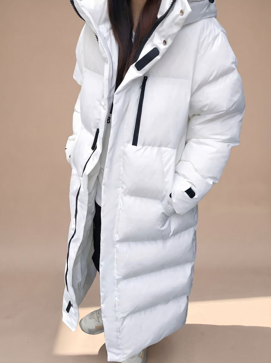 Daunenjacke Damen lang im Oversize-Schnitt mit Kapuze